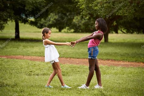 Children Playing Ring Around The Rosie In Park — Stock Photo © Diego