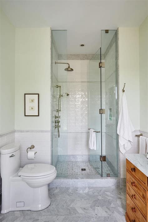 White Subway Tile And Glass Standup Shower In Elegant Marble Bathroom