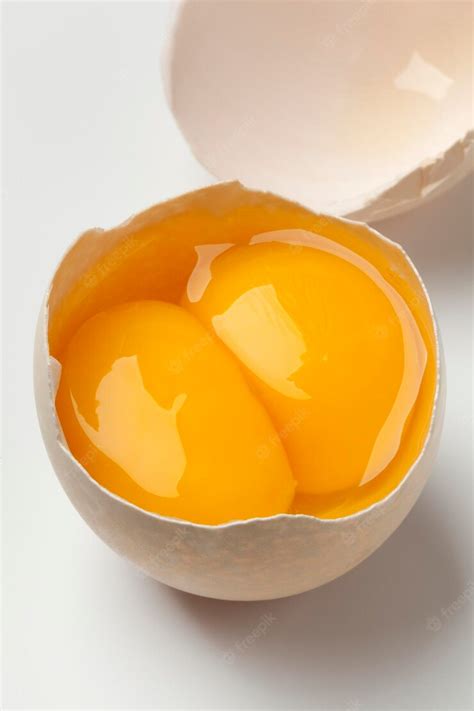 Premium Photo Broken Double Yolk Egg