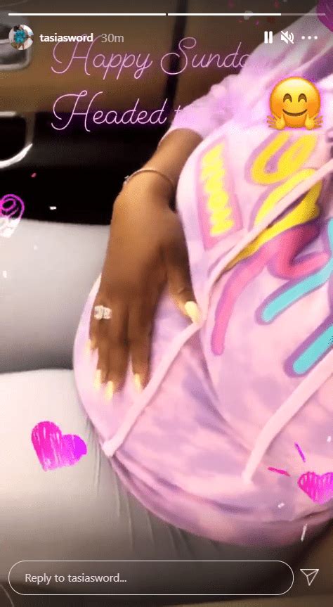 pregnant fantasia shows belly sitting in a car in a purple top while out to eat with son dallas