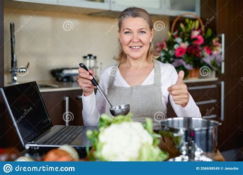Mature Woman In Kitchen Preparing Food Stock Image Image Of Cook