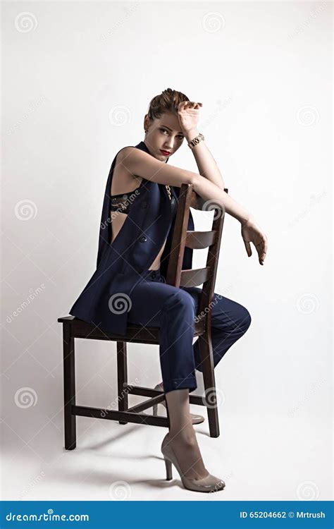 Girl Posing On A Chair In The Studio Stock Photo Image Of Lifestyle