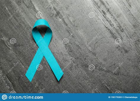 Teal Ribbon Awareness On Woman`s Hand For Ovarian Cancer Polycystic Ovary Syndrome Pcos Disease
