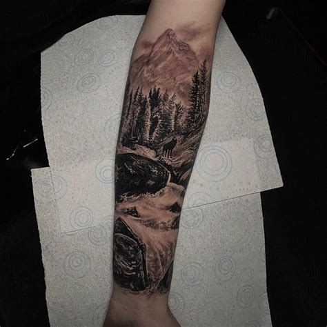 Wolf In A Mountain Forest Done By Eddy Black At Alchemy Tattoo Art