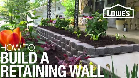 With three blocks laid, set a level on top and tap the blocks into place with the end of the trowel handle. How To Build a Retaining Wall - YouTube