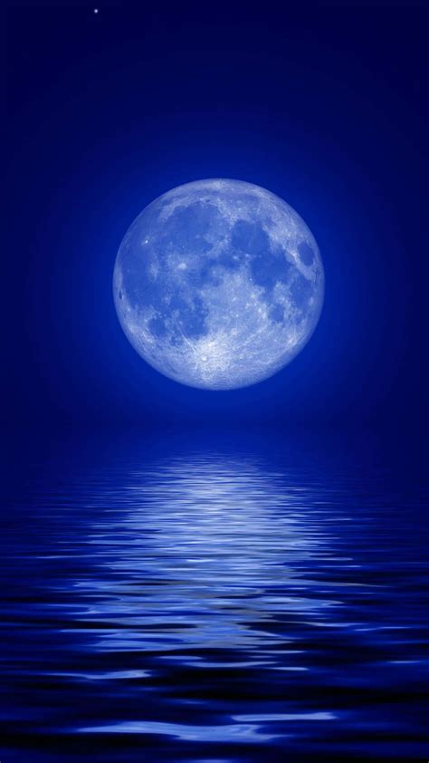 Download A Blue Moon Over Water With Stars