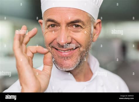 Happy Chef Looking At The Camera Making Ok Sign Stock Photo Alamy