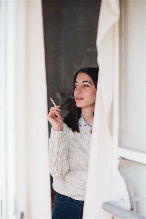 Beautiful Woman Smoking A Cigarette By Vertikala