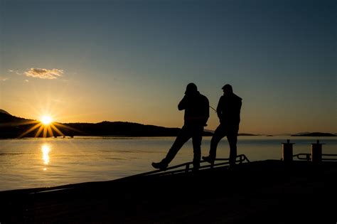Fishing With The Midnight Sun Rising In Harstad Northern Norway Norway