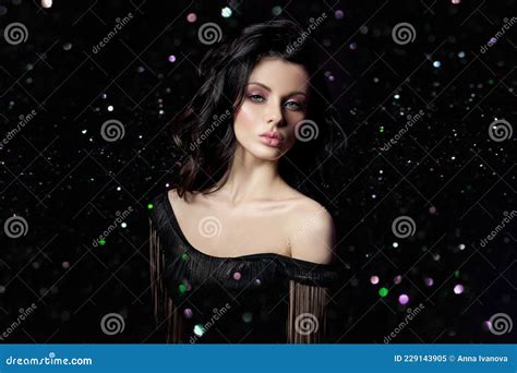 portrait brunette hair woman with a chic lush wavy hair plump lips bokeh glitter natural