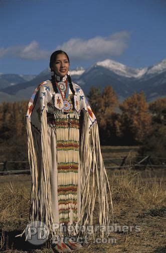 Traditional Lemhi Shoshone Woman Summer Baldwin Dressed In Beaded Regalia Poses With T