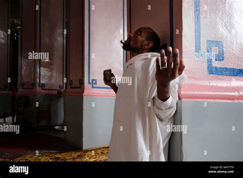 An Ethiopian Orthodox Worshipper Praying Inside The Ethiopian Church Of