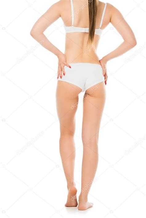 Vista Posterior De La Mujer Joven Sexy En Ropa Interior Posando Con Las Manos En Las Caderas