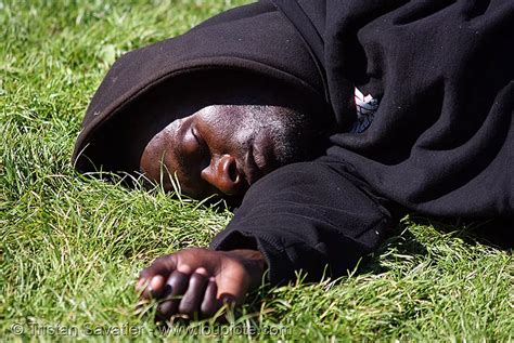 Black Man Sleeping On Grass 1079099542