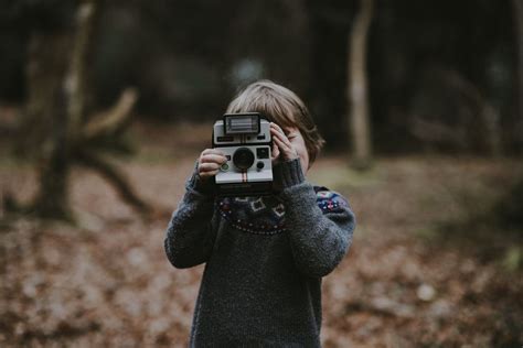 Boy Holding Polaroid Camera Photo By Annie Spratt Anniespratt On