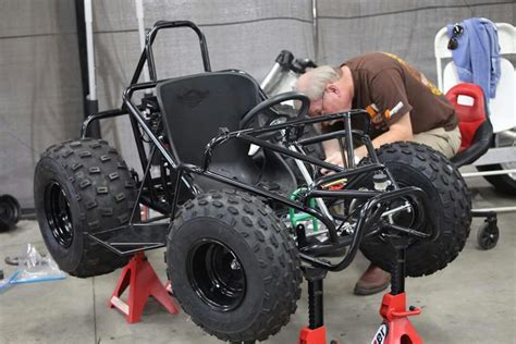 A Man Is Working On An Electric Vehicle