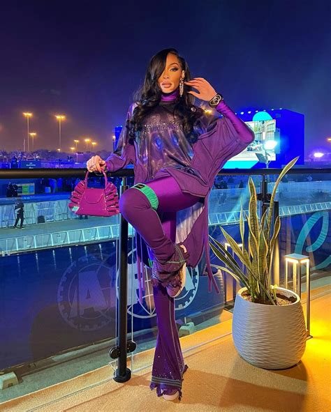 Winnie Harlow Stuns In Purple Themed Outfit At Formula E World