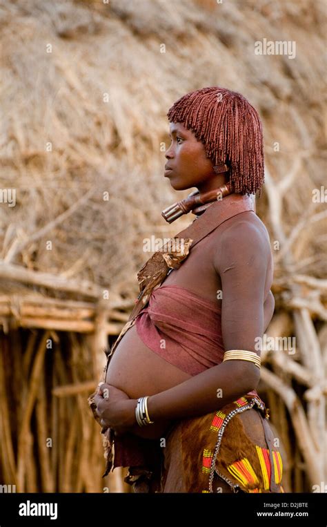 Portrait Of Hamar Pregnant Woman Standing In Front Of Hut Stock Photo Alamy