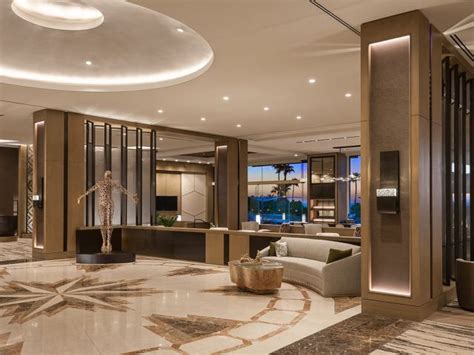 Main Lobby Of A Luxury Hotel With Shiny Tile Floors Modern Furniture