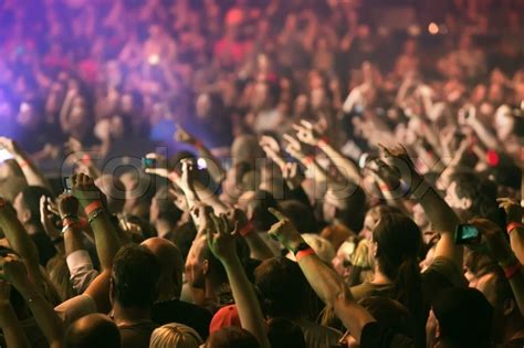 Crowd Cheering And Hands Raised At A Live Music Concert Stock Photo