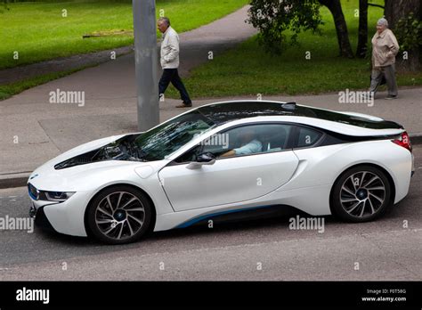 The 2015 Model Bmw I8 Plug In Hybrid Sports Car In White Driving In