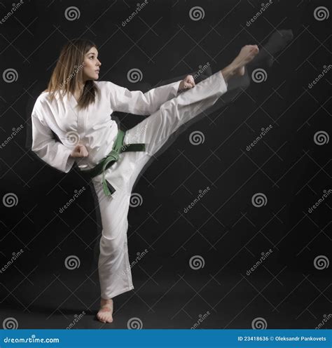 Woman Of Karate Performs A High Kick 01 Stock Photo Image Of