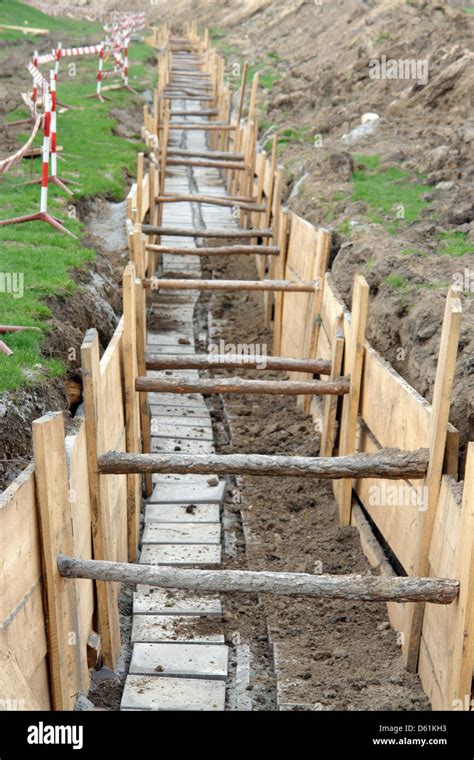 Long Earth Excavation Protected On Two Sides By Wooden Shuttering Stock