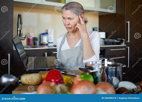 Mature Woman In Kitchen Preparing Food Stock Photo Image Of Healthy