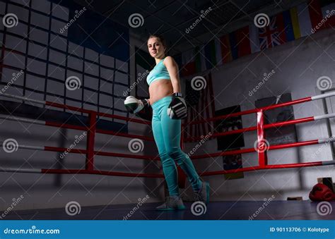 Young Female Boxer With Boxing Gloves Training And Prepares For Stock