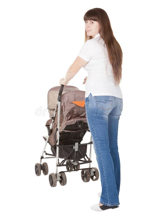 Full Length Portrait Of A Young Mother With A Baby And A Pushchair