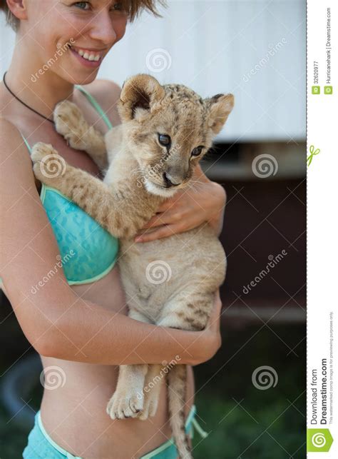 Blond Girl Holding Cute Little Lion Cub Stock Image Image Of Beautiful Carnivore 32620977