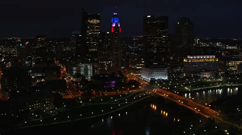 5 7k stock footage aerial video of flying by leveque tower and city skyline at night downtown