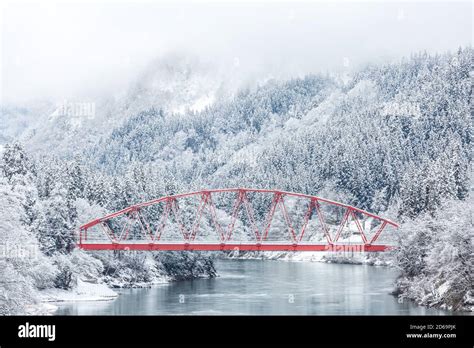Red Bridge With Winter Landscape Along Tadami River In Fukushima Japan