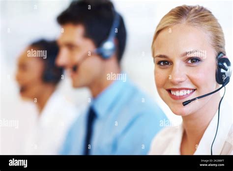 Service With Smile Closeup Of Professional Female Operator Smiling At Call Center Stock Photo