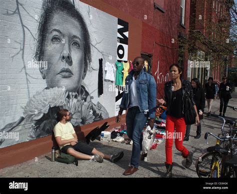 Street Vendors And Passers By Next To Mural Of Body Artist Marina Abramović Brooklyn New York