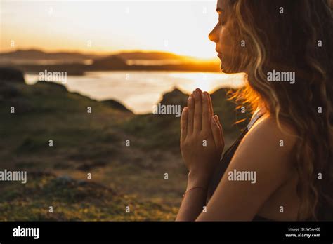 Woman Praying Alone At Sunrise Nature Background Spiritual And