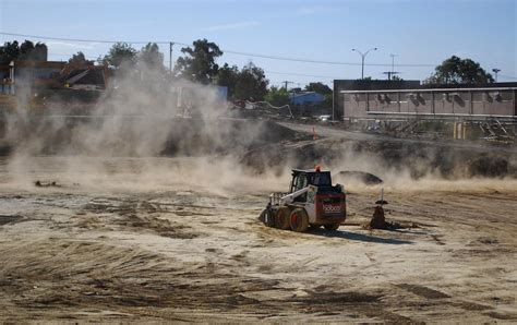 Construction of new buildings is an ongoing process in cities and suburbs. Winds whipping up dust at construction site - cropped | Flickr