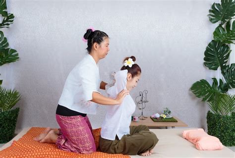Premium Photo Asian Woman Getting Traditional Thai Stretching Massage By Therapist