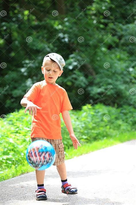 Boy Playing With Ball In Park Outdoors Stock Photo Image Of Happy