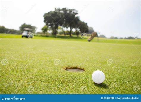 Golf Ball Near The Hole Stock Photo Image Of Pursuit 50486988