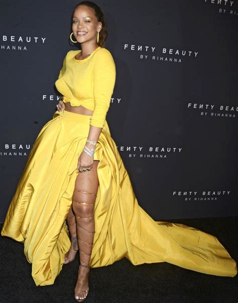 Rihanna Wearing A Vibrant Yellow Oscar De La Renta Ensemble And Custom