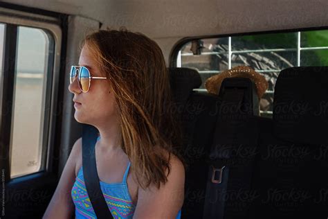 Young Teen In Car At The Beach By Gillian Vann Car Window Stocksy