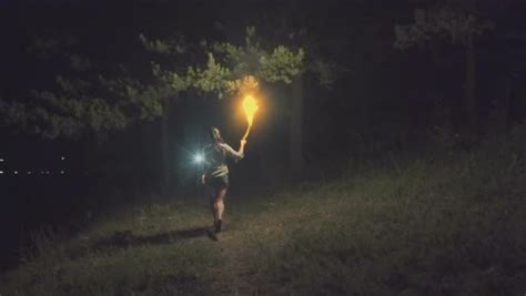 Young Woman With Torch Running In Woods At Night Stock Video Footage Dissolve