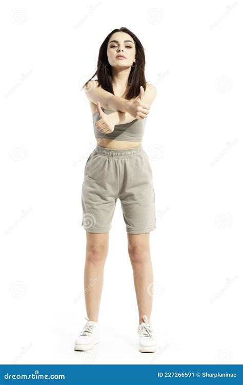 Cocky Attitude Young Beautiful Summer Woman Showing Thumbs Up With Crossed Arms Stock Image