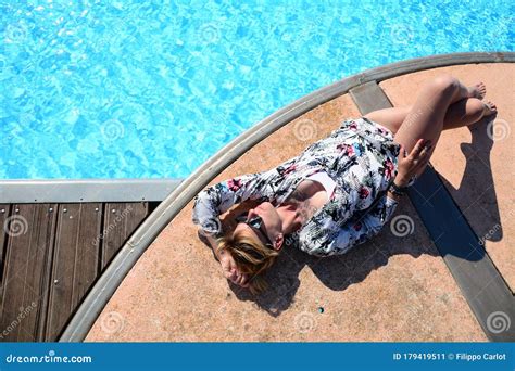 Blonde Girl Lying On The Swimming Pool 9 Stock Image Image Of Model Attractive 179419511