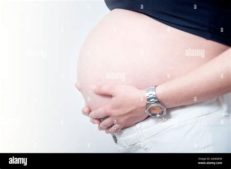 Pregnant Woman Caressing Her Belly Stock Photo Alamy