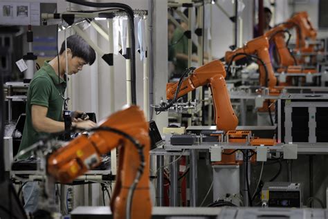Robot Revolution Rises In China Factories The Japan Times