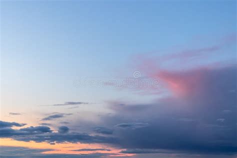 Colorful Sunrise With Clouds Light Rays In Blue Sky Stock Photo