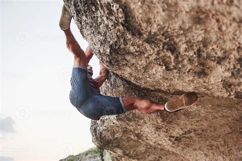 A Young Man Climbers Climb A Rock Extreme Rest Style Of Life Free And