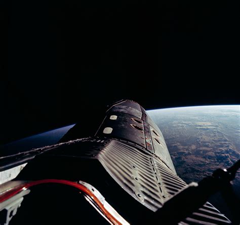 The Nose Of Gemini 12 And The Grandeur Of Earth As Captured By Buzz